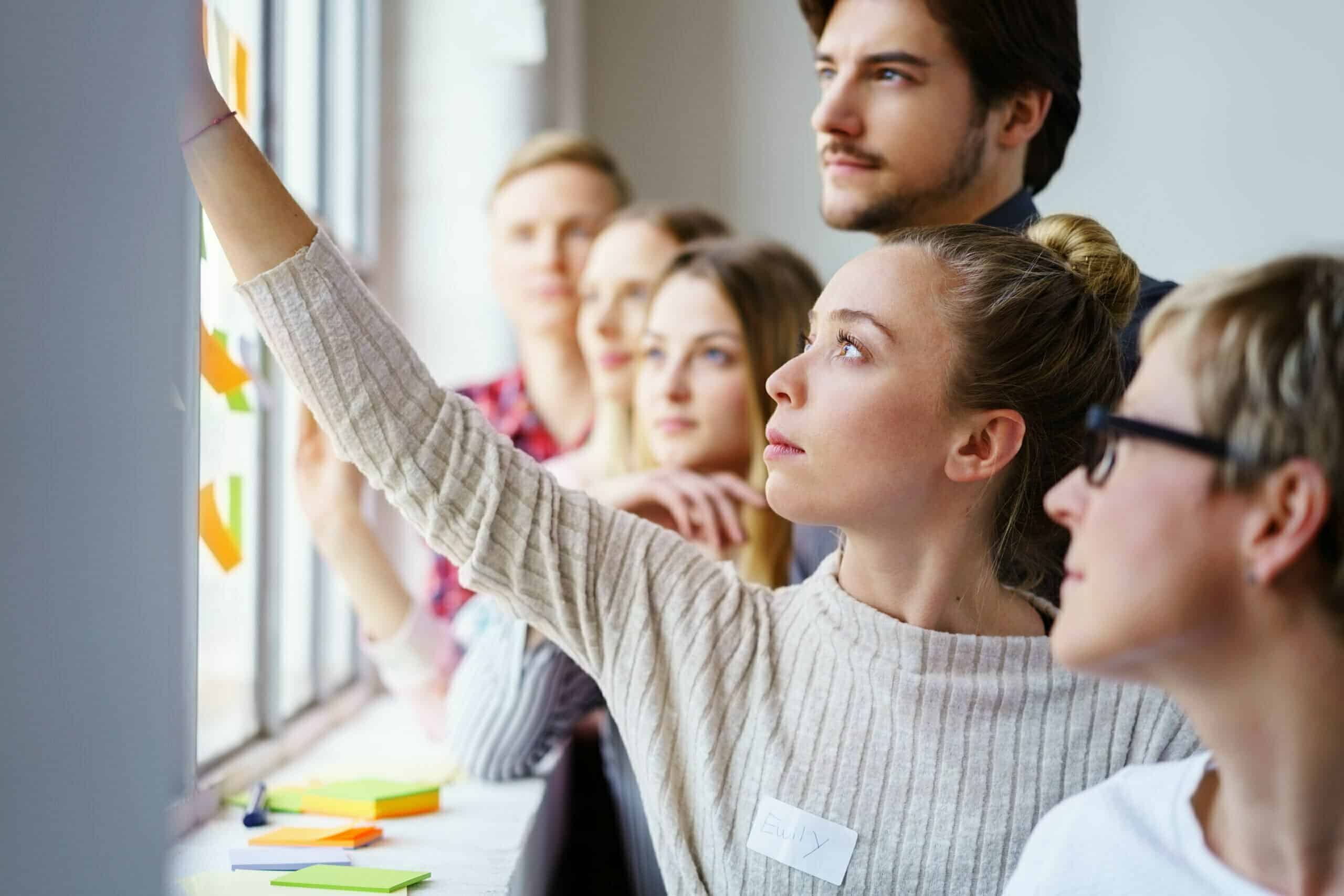 Office Team Brain Storming Ideas With Sticky Notes