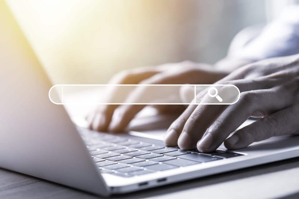 Businessman Using Laptop Computer To Input Keyword For Search And Find Knowledge.