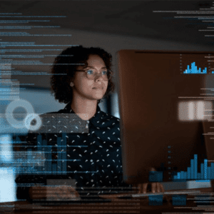 Image of Woman working at computer screen with graphs and charts overlayed on image representing API Management
