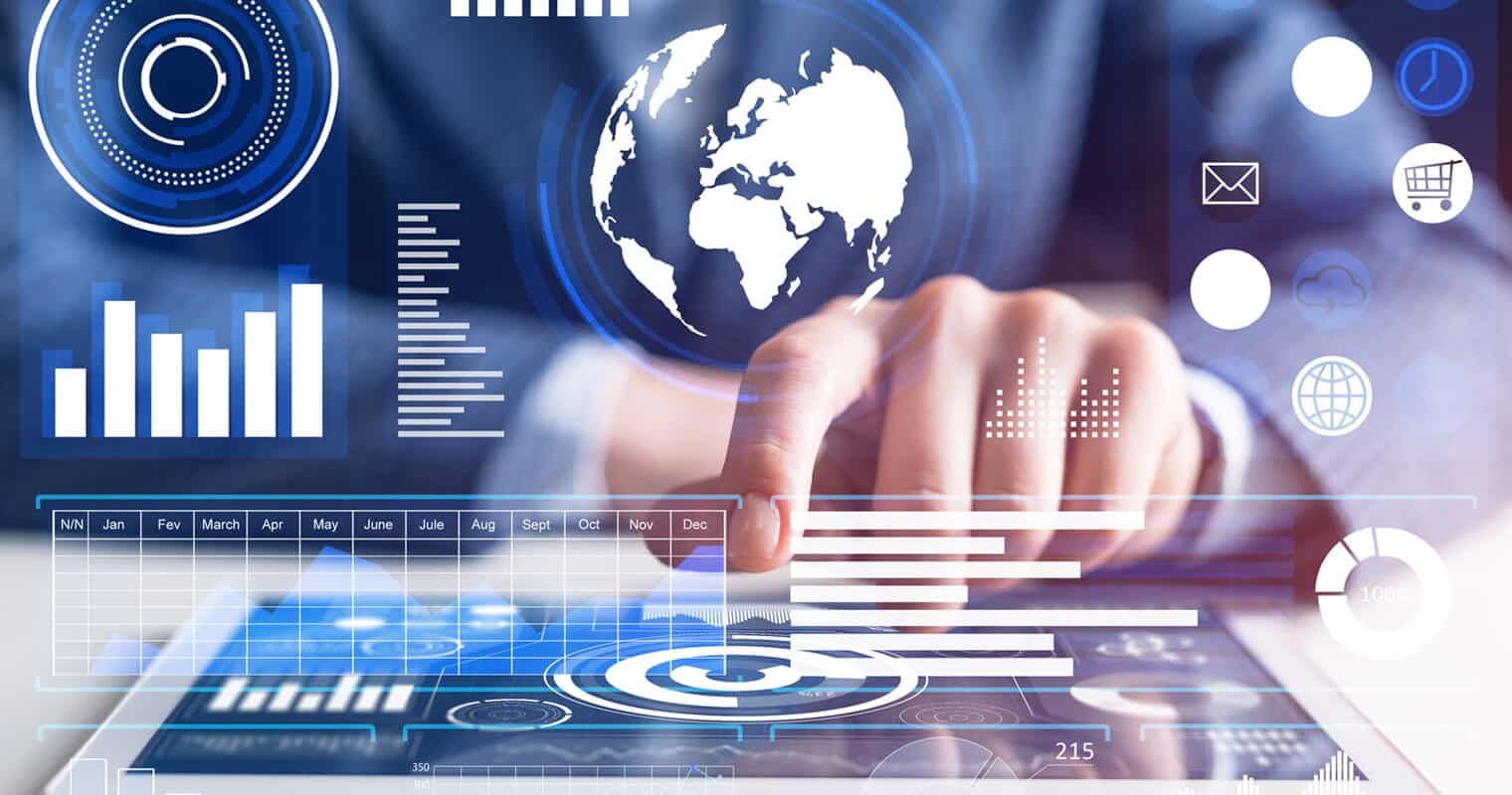 A person uses a touch screen with charts, graphs, and a digital globe, symbolizing global self-service analytics and interconnected data functions