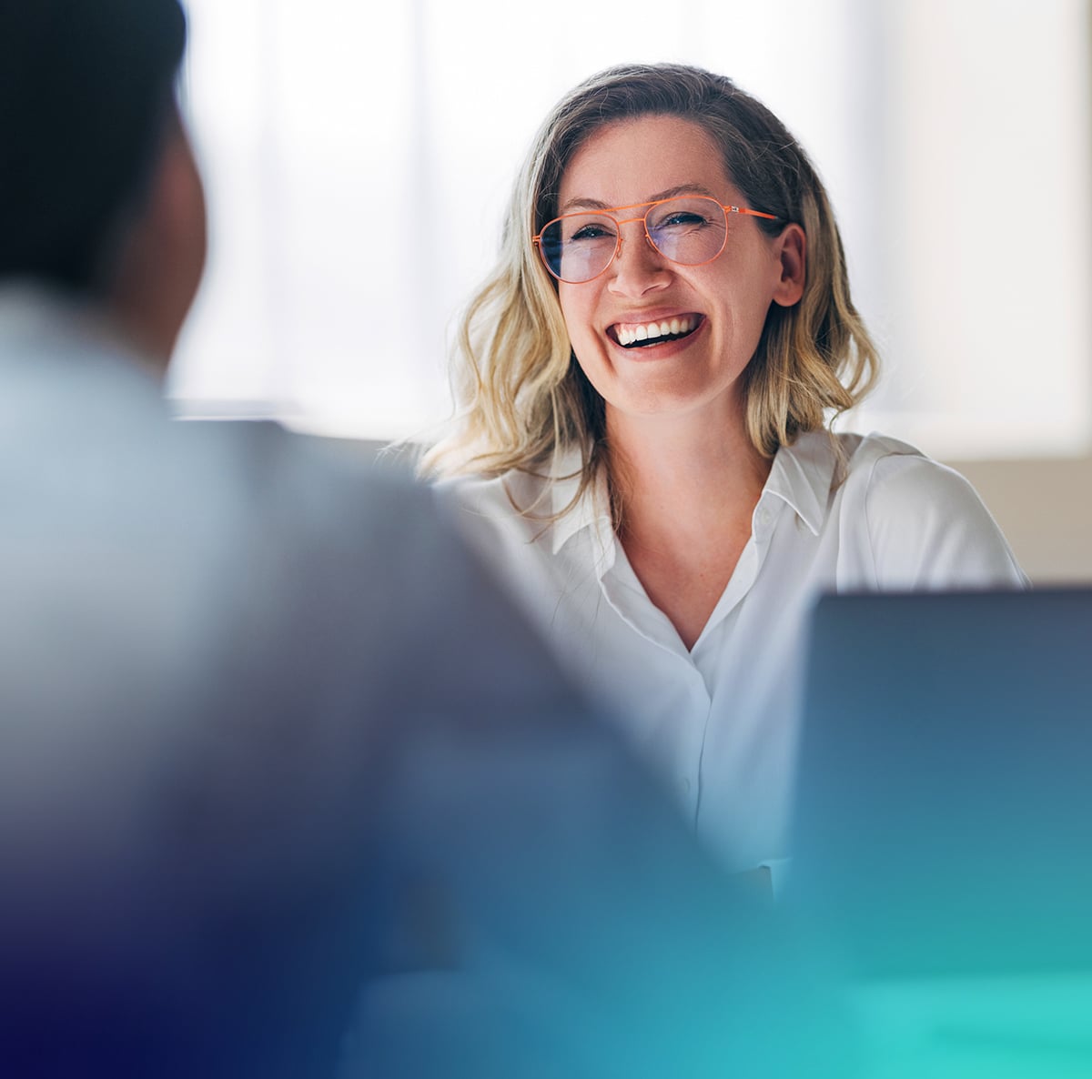 woman smiling and sharing their success story with the actian data intelligence platform