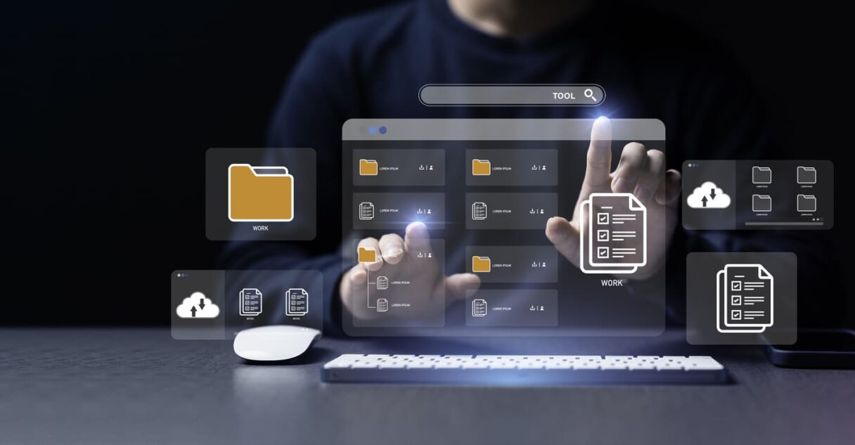 Businessman using a computer to document management concept, online documentation database and digital file storage system or software, records keeping, database technology, file access, doc sharing.