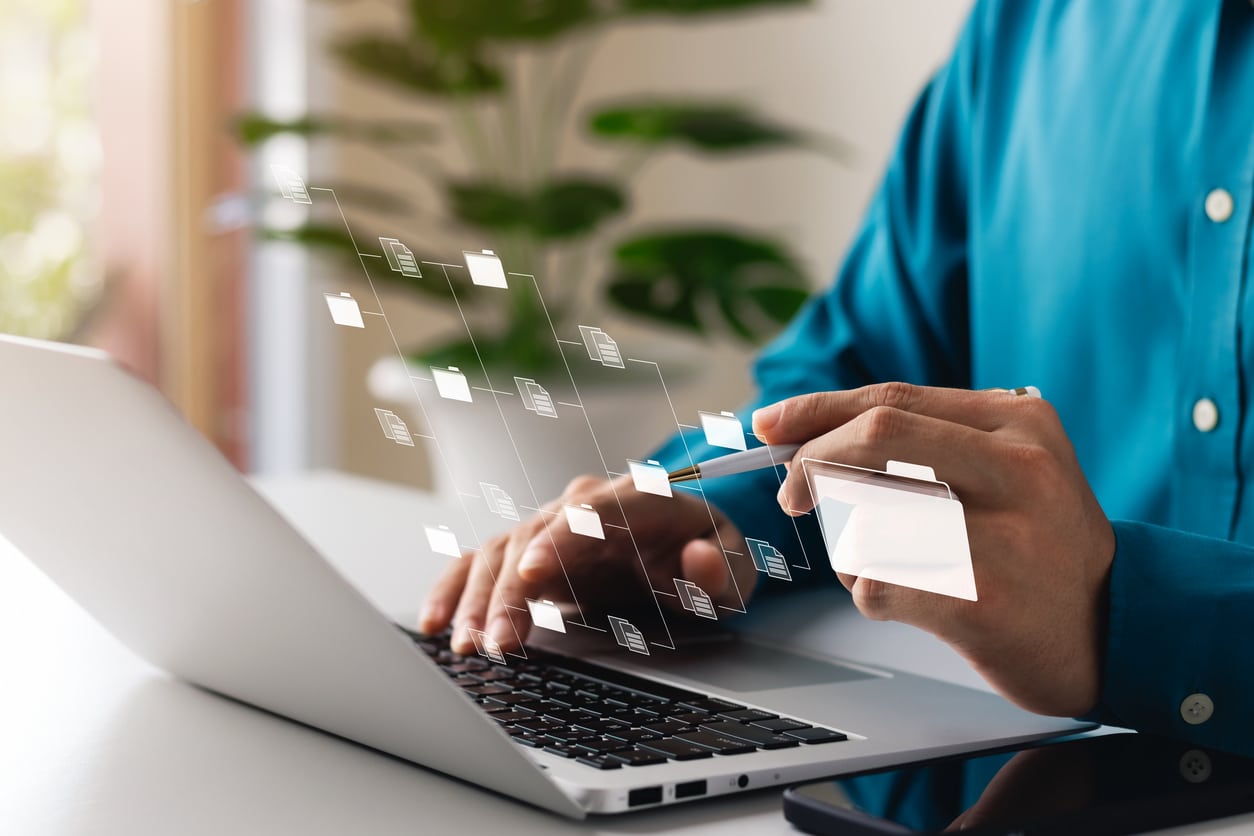 person touching a screen to look at data mesh